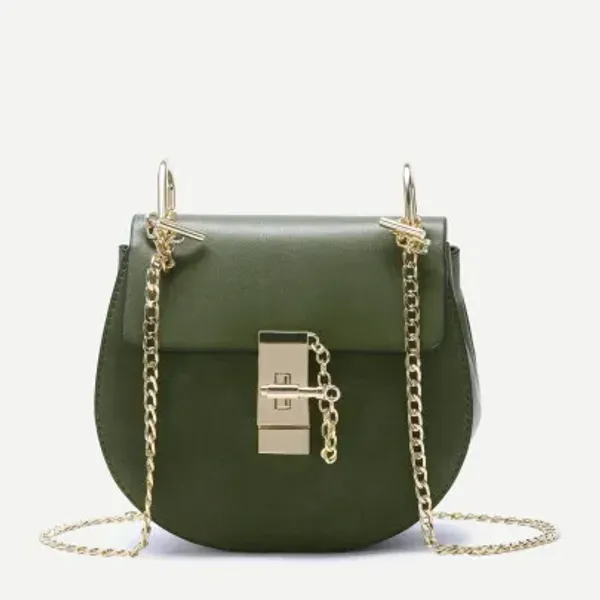 A stylish olive green saddle bag featuring a gold-tone push-lock closure with an attached decorative chain. The bag has a structured design with a curved silhouette and a matching gold chain shoulder strap, adding a touch of elegance. Its compact yet functional size makes it a versatile accessory for both casual and formal occasions.