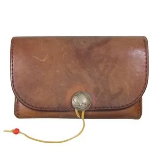 A vintage-style brown leather wallet with a button and string closure. The wallet features a curved flap secured by a round metallic button, with a thin yellow cord looped around it, finished with a small red bead. The distressed leather gives it a rustic and handcrafted appearance, making it a stylish and functional accessory.